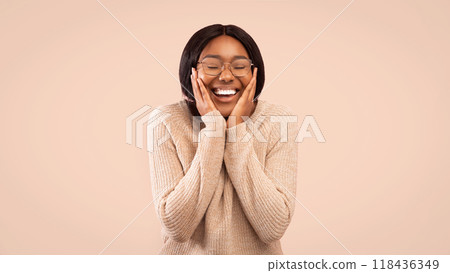 Joy. Happy Afro Girl Holding Hands On Cheeks And Smiling Standing Over Pink Studio Background. Panorama, Free Space Joy. Happy Afro Girl Holding Hands On Cheeks And Smiling Standing Over Pink Studio Background. Panorama, Free Space 118436349