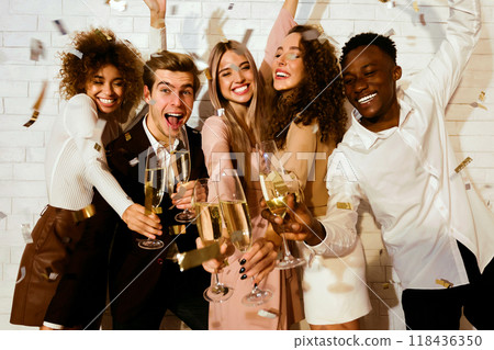 Happy Multicultural Friends Partying Having Fun Celebrating Holiday With Champagne And Confetti Indoor. Party Concept 118436350