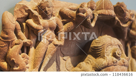 Close-up view on Ancient Stone Bas-relief Of Brahmani Or Brahmi, One Of Seven Hindu Mother Goddesses Known As Sapta Matrikas. She Is Aspect Of Adi Shakti, Possessing rajas Guna And Source Of Brahmas 118436616