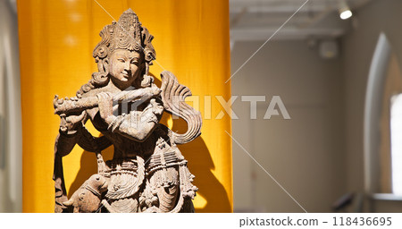 Statue Of Krishna Playing Flute. Krishnas Love Songs Are Both Shravya And Drishya -heard And Seen-. He Is God Of Protection, Compassion, Tenderness, And Love. Krishna Is Major Deity In Hinduism 118436695