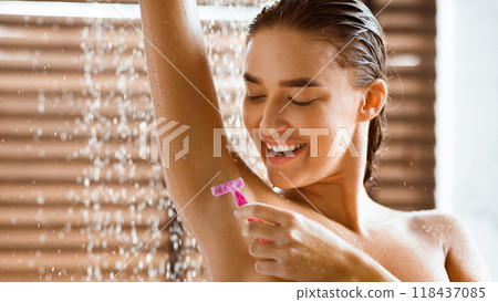 Woman Shaving Underarms, Standing Under Water Drops, Taking Shower 118437085
