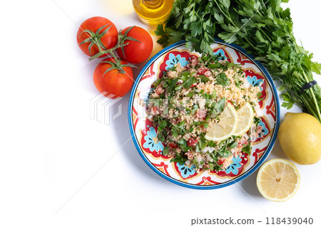 Tabbouleh salad with couscous isolated on white background Tabbouleh salad with couscous isolated on white background 118439040