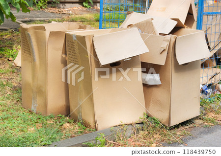Cardboard and waste paper is packaged for recycling. Waste stacked. Pile of cardboard is sorting for recycled. Cardboard and waste paper is packaged for recycling. Waste stacked. Pile of cardboard is sorting for recycled. 118439750