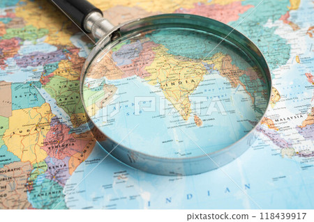 Bangkok, Thailand - June 15, 2024 India, Magnifying glass close up with colorful world map, travel, geography, tourism and exploration concept. Bangkok, Thailand - June 15, 2024 India, Magnifying glass close up with colorful world map, travel, geography, tourism and exploration concept. 118439917