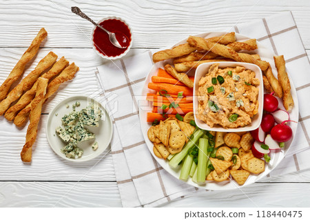 buffalo chicken dip with veggie and bread sticks buffalo chicken dip with veggie and bread sticks 118440475