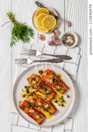 salmon piccata with lemon caper sauce on plate salmon piccata with lemon caper sauce on plate 118440479