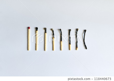 Burnt matches over white background Burnt matches over white background 118440673