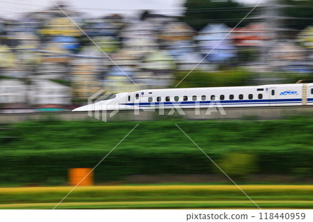 Colorful triangular roofed residential area and the Shinkansen 118440959
