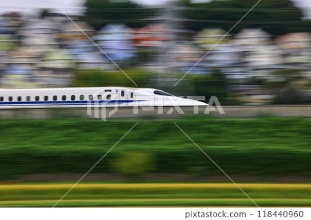 Colorful triangular roofed residential area and the Shinkansen 118440960
