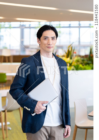 Middle-aged businessman working in an office. Photo courtesy of Denpa Gakuen, Tokyo Electronics College. Middle-aged businessman working in an office. Photo courtesy of Denpa Gakuen, Tokyo Electronics College. 118441580