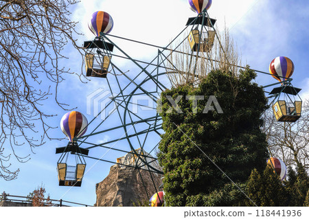 Carousel in an amusement park on a sunny day. 118441936