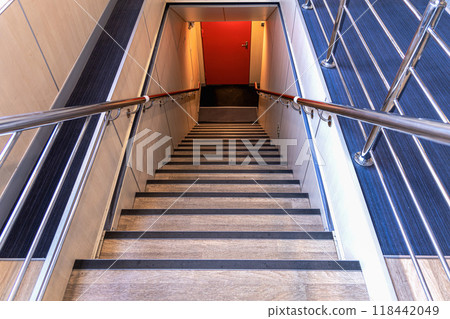 Stairs leading down on the ferry. Exit outside. 118442049