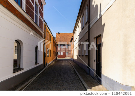 Narrow streets of the old town with colorful houses. Narrow streets of the old town with colorful houses. 118442091