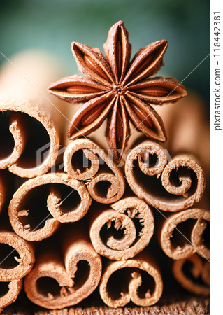 Macro shot of anise star and heap of cinnamon sticks close up Macro shot of anise star and heap of cinnamon sticks close up 118442381