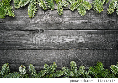 Winter Holidays background with a border of green fir branches 118442417