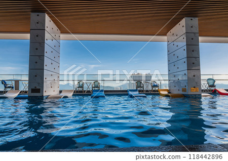 interior on roof of a luxury skyscraper hotel with a swimming pool 118442896