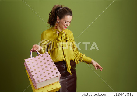 happy modern woman in green blouse isolated on green background happy modern woman in green blouse isolated on green background 118443813