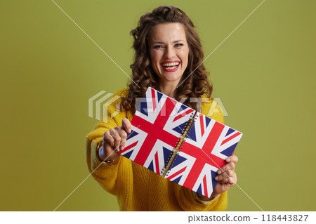smiling healthy 40 years old woman against green background 118443827