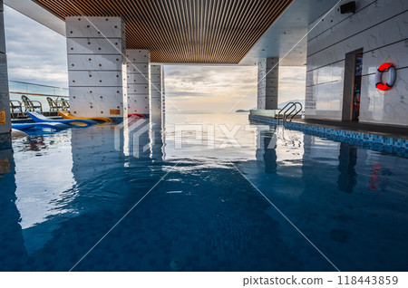 interior of luxury skyscraper hotel with rooftop pool overlooking the sea 118443859