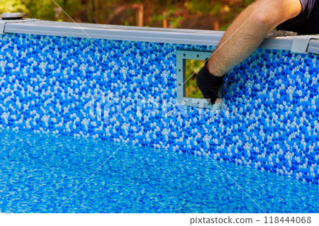 Swimming pool maintenance installed on frame skimmer basket collects dirt trash using filtration system water surface cleaning swimming pool care Swimming pool maintenance installed on frame skimmer basket collects dirt trash using filtration system water surface cleaning swimming pool care 118444068