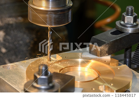 The hole drilling process on NC milling machine with brass material. The hole drilling process on NC milling machine with brass material. 118445017