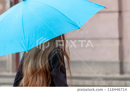 Woman walking on the street 118446714