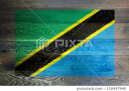 Tanzania flag on rustic old wood surface background Tanzania flag on rustic old wood surface background 118447946