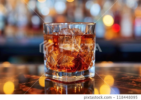 Whiskey on a wooden table with ice  118448095
