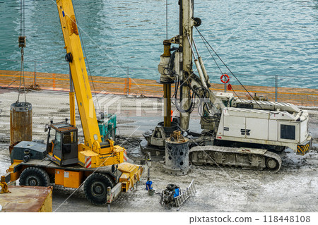 Installation of pile casings in the port quay, drilling rig, port infrastructure upgrade works 118448108