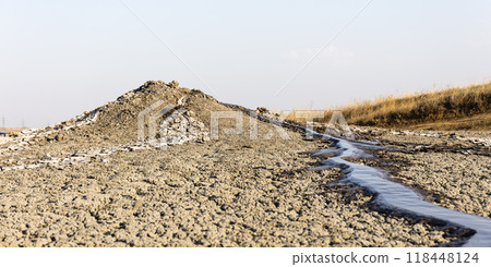 photo of a mud volcano eruption, landscape photography 118448124