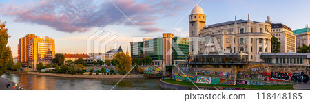 vienna, austria - 17 oct 2019: donaukanal embankment panorama in autumn. urania observatory beautiful architecture and trees in fall season at sunset. urban scenery near aspernbrucke in evening light 118448185
