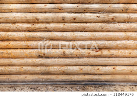 New wooden wall made of uncolored natural pine tree logs, texture New wooden wall made of uncolored natural pine tree logs, texture 118449176