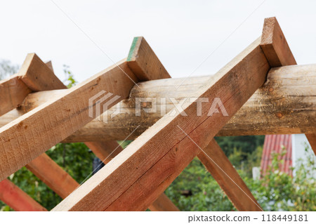 Wooden house roof is under construction. Background photo Wooden house roof is under construction. Background photo 118449181