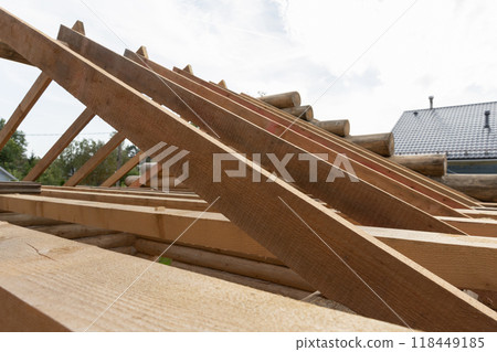 Wooden house roof is under construction. Background photo Wooden house roof is under construction. Background photo 118449185