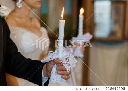 Elegant Wedding Ceremony with Candlelight in a Church Setting Capturing a Moment of Sacred Union Elegant Wedding Ceremony with Candlelight in a Church Setting Capturing a Moment of Sacred Union 118449306