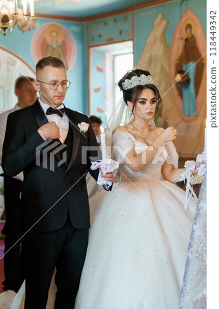 Elegant Wedding Ceremony in Ornate Church Setting Capturing Sacred Traditions and Timeless Love Elegant Wedding Ceremony in Ornate Church Setting Capturing Sacred Traditions and Timeless Love 118449342