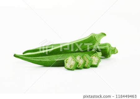 Fresh Okra pods and slices on a white background Fresh Okra pods and slices on a white background 118449463