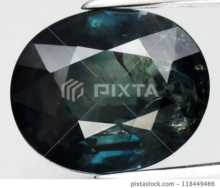 Exquisite Close-Up of a Faceted Dark Green Gemstone Showcasing Intricate Clarity and Intense Color Depth 118449466