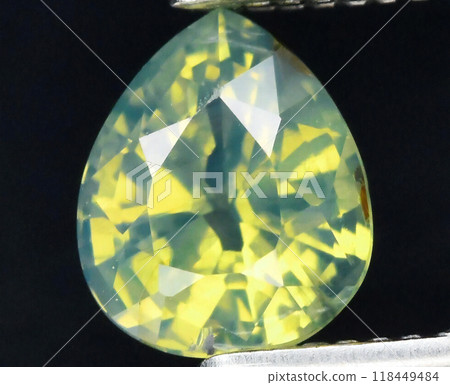 Radiant Yellow Sapphire Gemstone Gracefully Captured in Close-Up, Showcasing Its Mesmerizing Facets and Luminous Brilliance 118449484