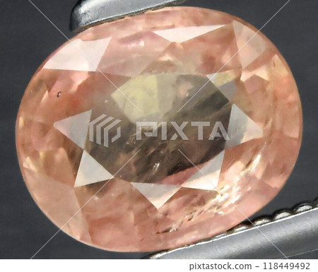 Elegant Oval Cut Peach Sapphire Gemstone in Precision Focus 118449492