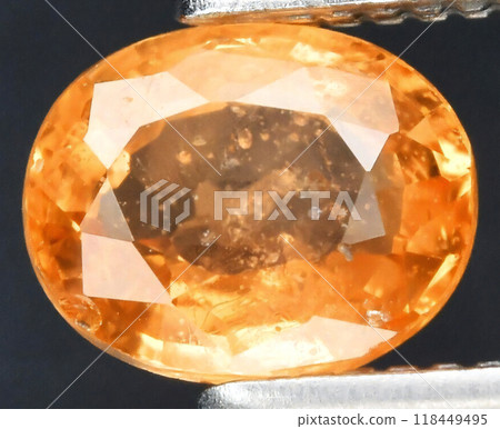 Exquisite Close-Up of a Sparkling Orange Faceted Gemstone Exquisite Close-Up of a Sparkling Orange Faceted Gemstone 118449495
