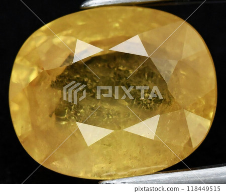 Radiant Yellow Sapphire Gemstone Close-up with Intricate Facets Radiant Yellow Sapphire Gemstone Close-up with Intricate Facets 118449515
