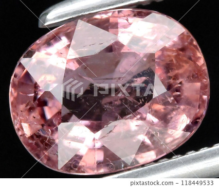 Exquisite Oval-Cut Pink Gemstone Sparkling with Elegance Exquisite Oval-Cut Pink Gemstone Sparkling with Elegance 118449533