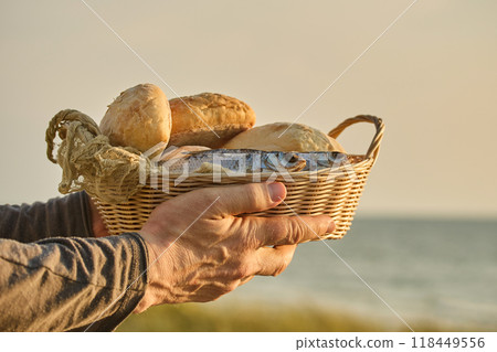 Christianity, religion, Bible concept. Five loaves of bread and two fish Christianity, religion, Bible concept. Five loaves of bread and two fish 118449556