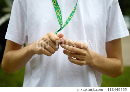 Sunflower lanyard, symbol of people with invisible or hidden disabilities. Sunflower lanyard, symbol of people with invisible or hidden disabilities. 118449565