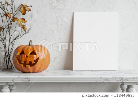 Halloween Invitation. A carved pumpkin with a spooky grin next to a blank canvas Halloween Invitation. A carved pumpkin with a spooky grin next to a blank canvas 118449683