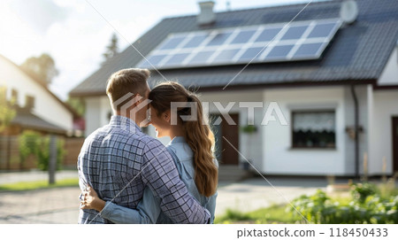 Couple Embracing in Front of Solar-Powered Home Couple Embracing in Front of Solar-Powered Home 118450433