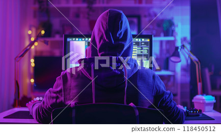 Hacker in Hoodie at Computer Workstation Hacker in Hoodie at Computer Workstation 118450512