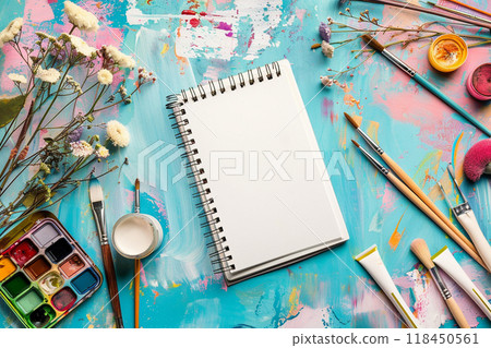 Colorful Artistic Workspace with Blank Sketchbook 118450561