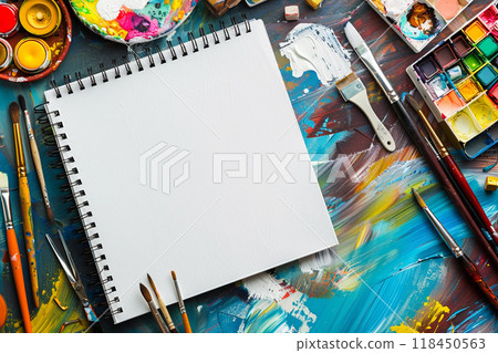 Artistic Workspace with Blank Sketchbook 118450563
